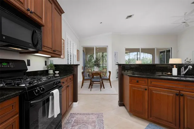 a bathroom with a bathtub shower sink vanity and toilet