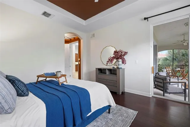 a view of a city with lots of residential buildings ocean and mountain view in back