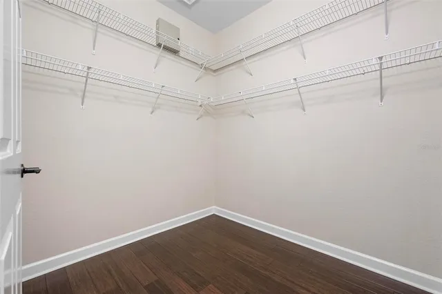 a view of a city with lots of residential buildings ocean and mountain view in back