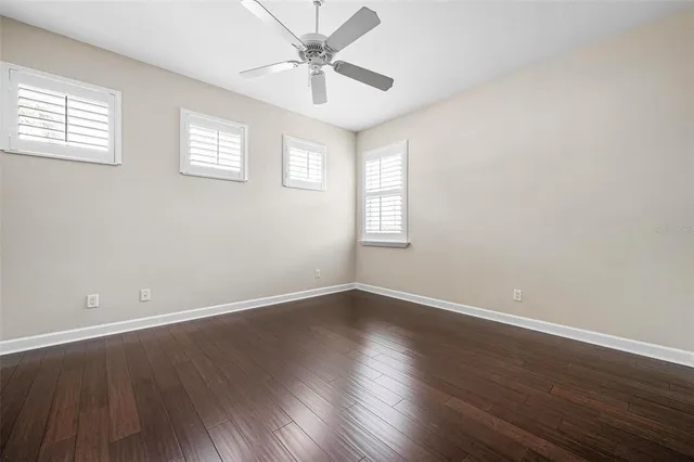 a front view of a house with a garden and plants