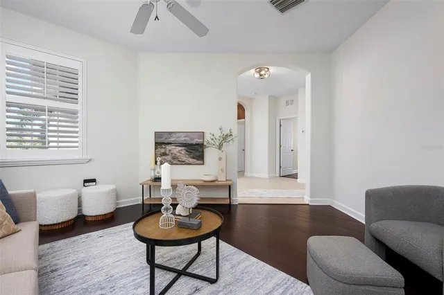 a living room with furniture and a large window