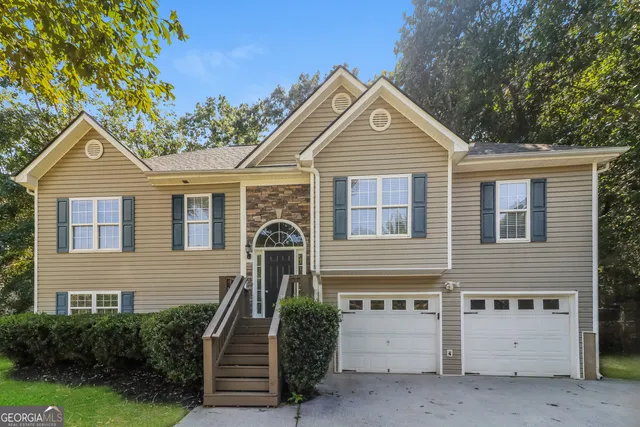 a front view of a house with a yard