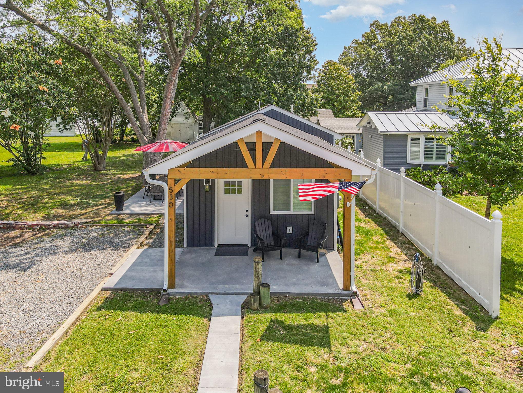 530 Monroe Bay Avenue Colonial Beach, VA 22443 - Photo 16 of 33 a view of a house with a yard patio and a slide