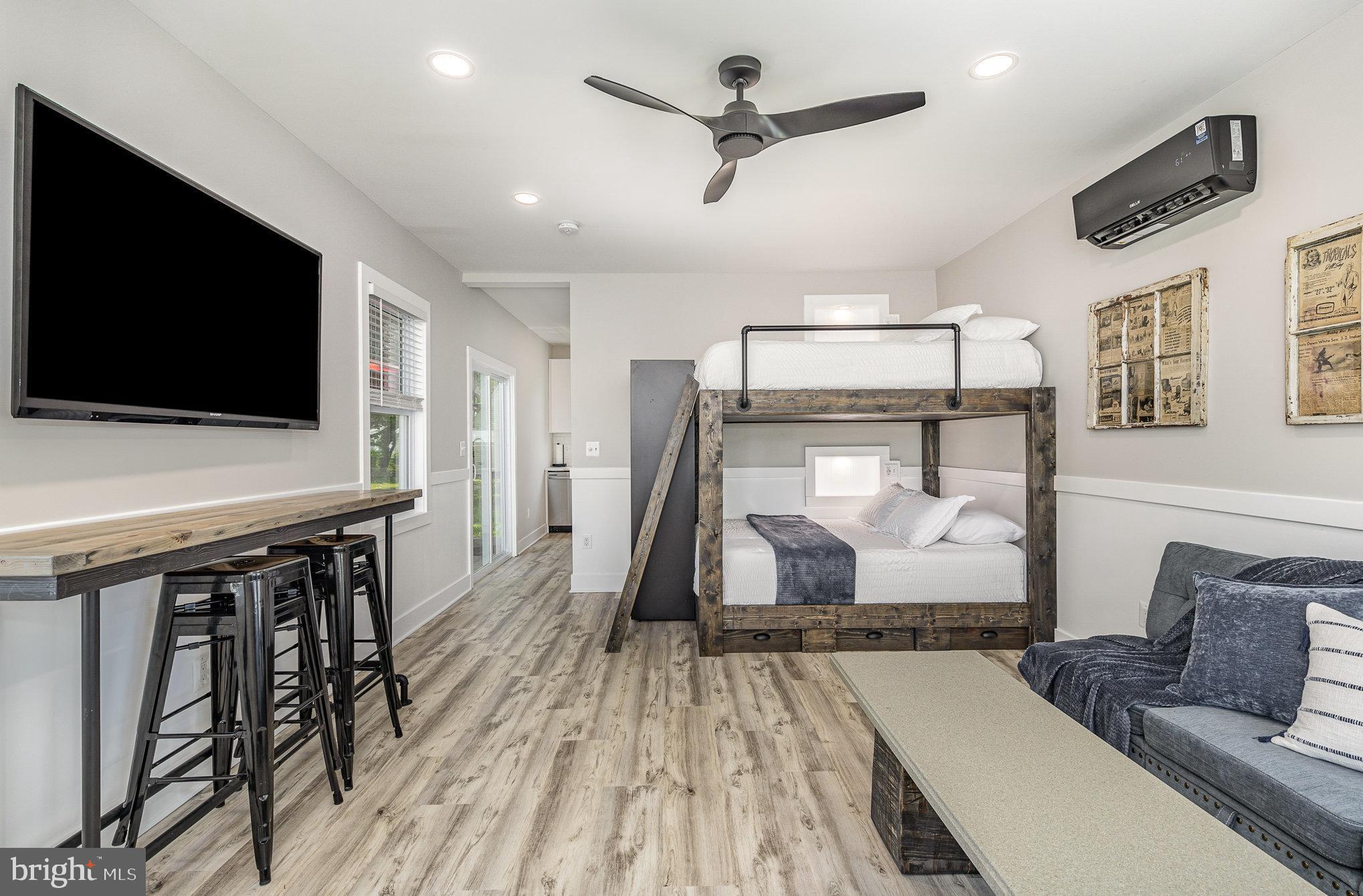 530 Monroe Bay Avenue Colonial Beach, VA 22443 - Photo 4 of 33 a living room with furniture and a flat screen tv