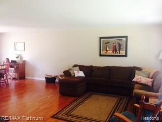 7680 Sharpe Road Fowlerville, MI 48836 - Photo 8 of 14 Family room is large and gives you the perfect opportunity to arrange your furniture just the way you like it!