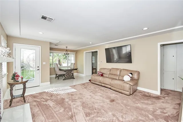 a bedroom with a bed and a desk next to a window