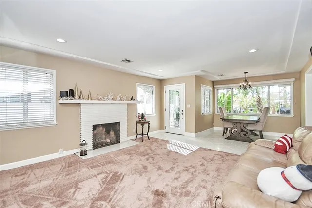 a bedroom with a bed and a desk next to a window