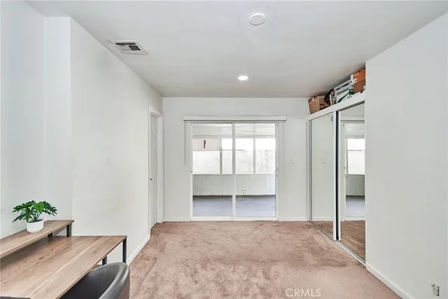 a kitchen with stainless steel appliances a stove a refrigerator and cabinets