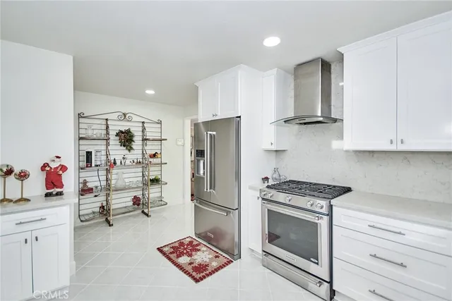 a dining room with furniture and a floor to ceiling window