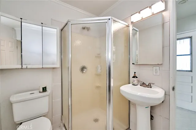 a bedroom with a bed and a view of bathroom