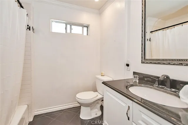 a potted plant sitting in front of a house