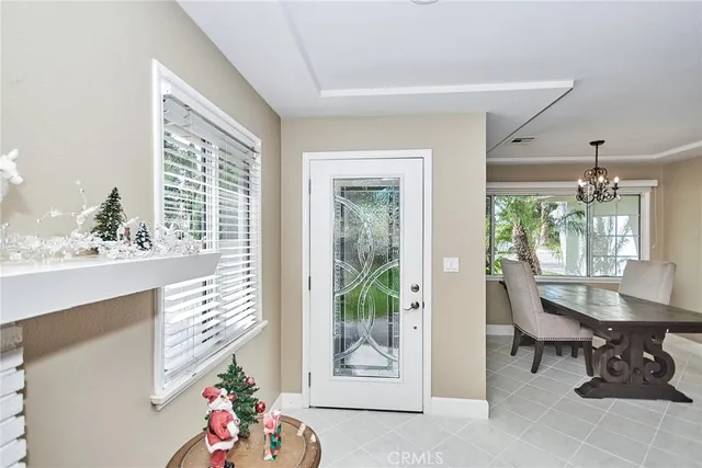 a view of a patio with table and chairs and potted plants