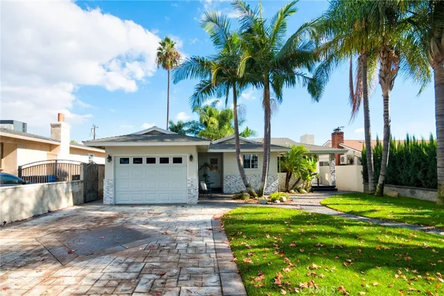 a view of swimming pool with lawn chairs under an umbrella
