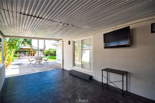 aerial view of a house with a yard basket ball court