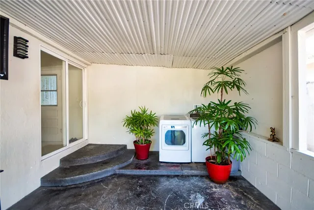 an aerial view of multiple houses with yard