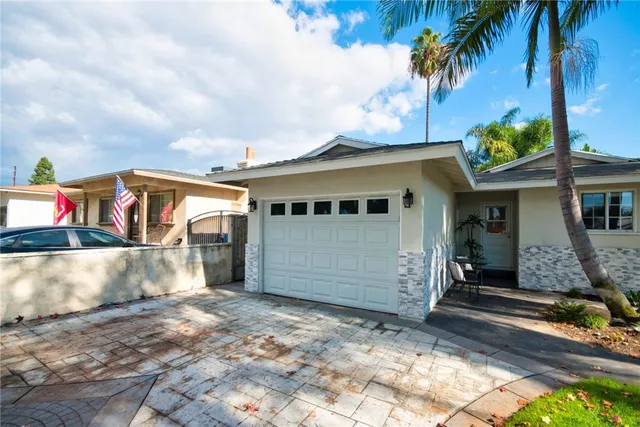 a front view of house with outdoor seating