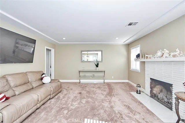 a living room with furniture and a chair