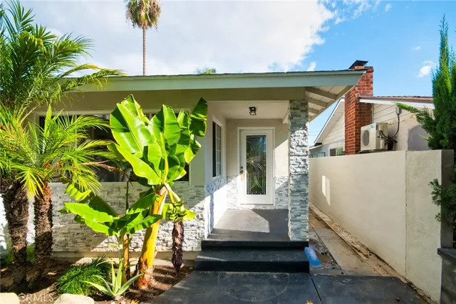 a living room with furniture and a chair