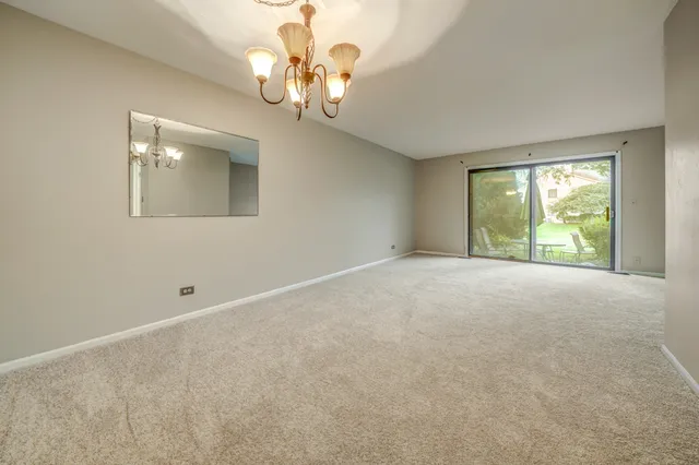 a view of an empty room with windows