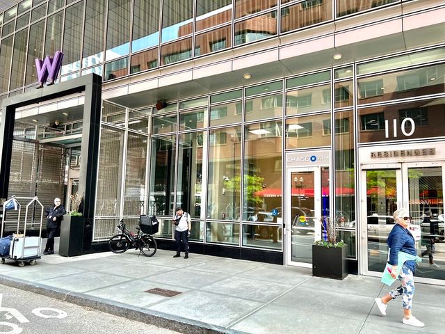 a view of a building with sitting area