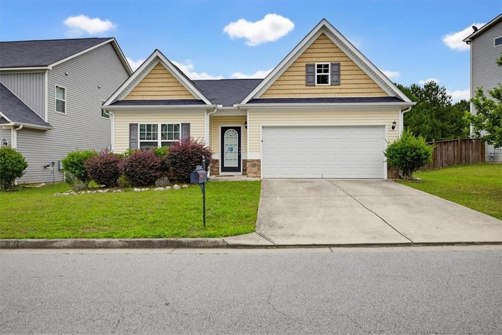 314 Boulder Run Hiram, GA 30141 - Photo 1 of 31 a front view of a house with a yard and garage