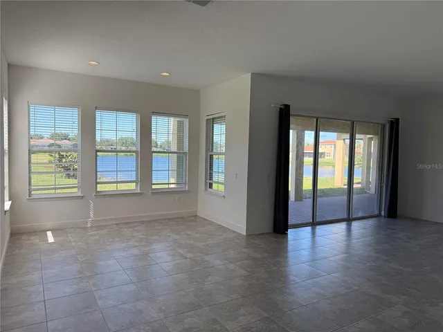 a bathroom with a shower and a glass door