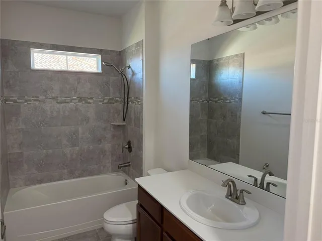 an aerial view of a house with a ocean view