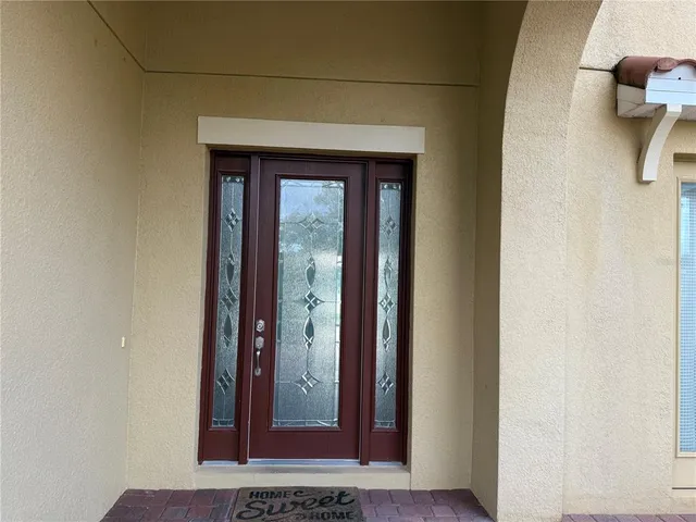 a large kitchen with stainless steel appliances kitchen island granite countertop a refrigerator and a stove top oven