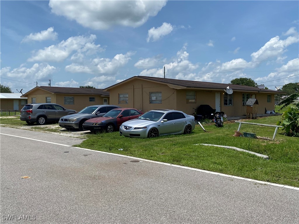 599 Avenue R Moore Haven, FL 33471 - Photo 6 of 23 a view of a car parked in front of a house