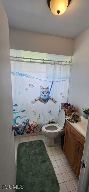 599 Avenue R Moore Haven, FL 33471 - Photo 10 of 23 a bathroom with a toilet a sink and a mirror