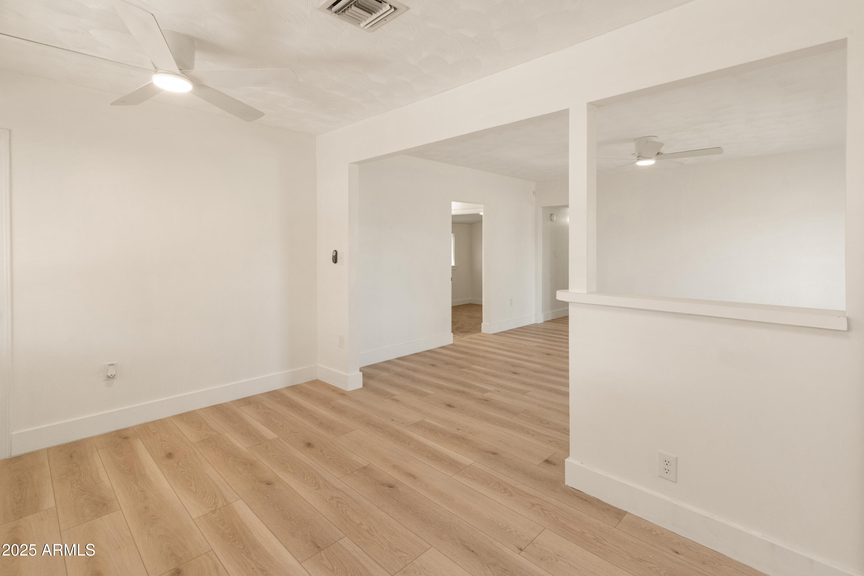 1407 East Mountain View Road Phoenix, AZ 85020 - Photo 11 of 35 wooden floor in an empty room