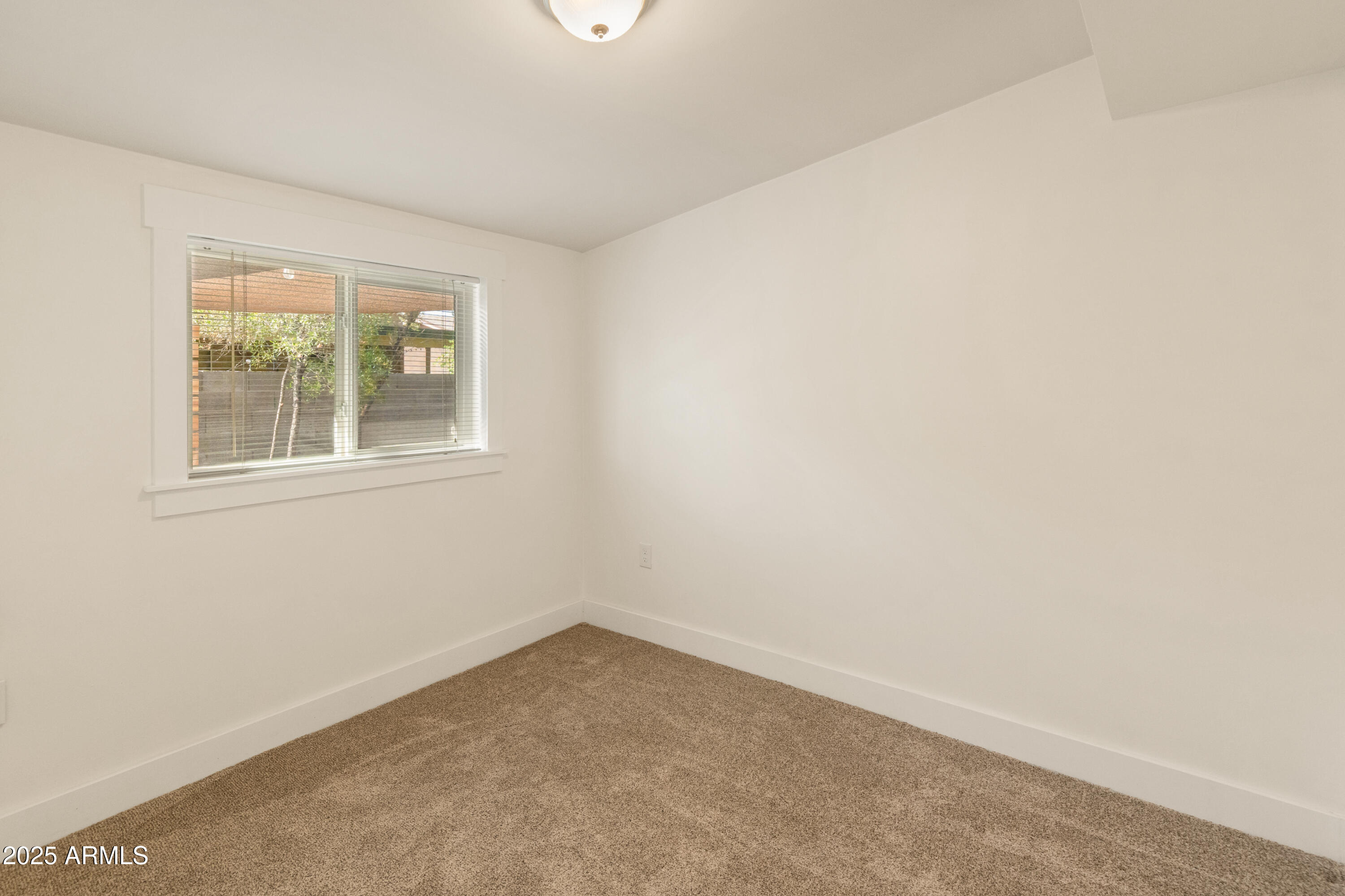 1407 East Mountain View Road Phoenix, AZ 85020 - Photo 16 of 35 an empty room with a window