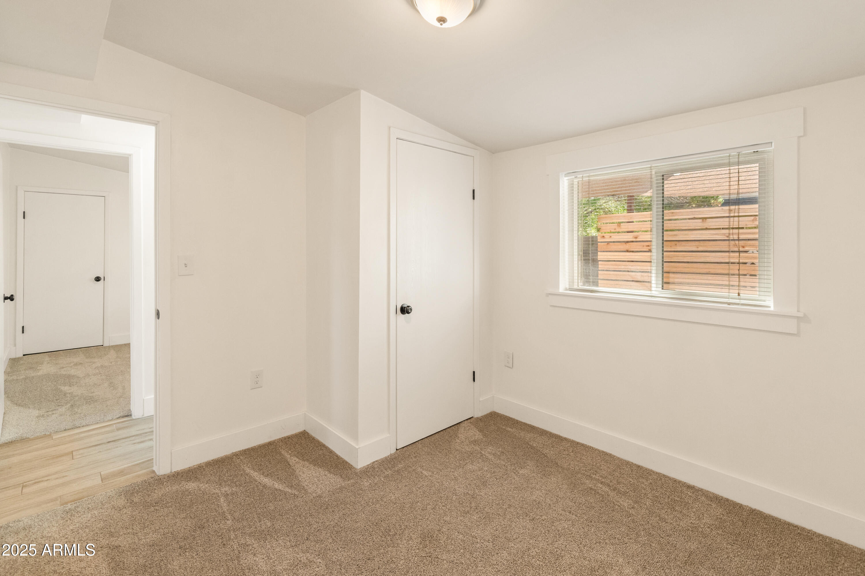 1407 East Mountain View Road Phoenix, AZ 85020 - Photo 17 of 35 an empty room with a window