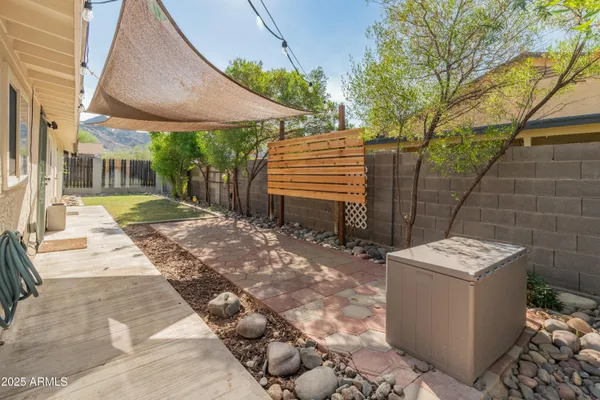 a view of a backyard with sitting area