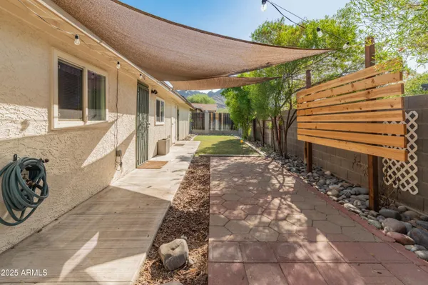 a view of a backyard with sitting area