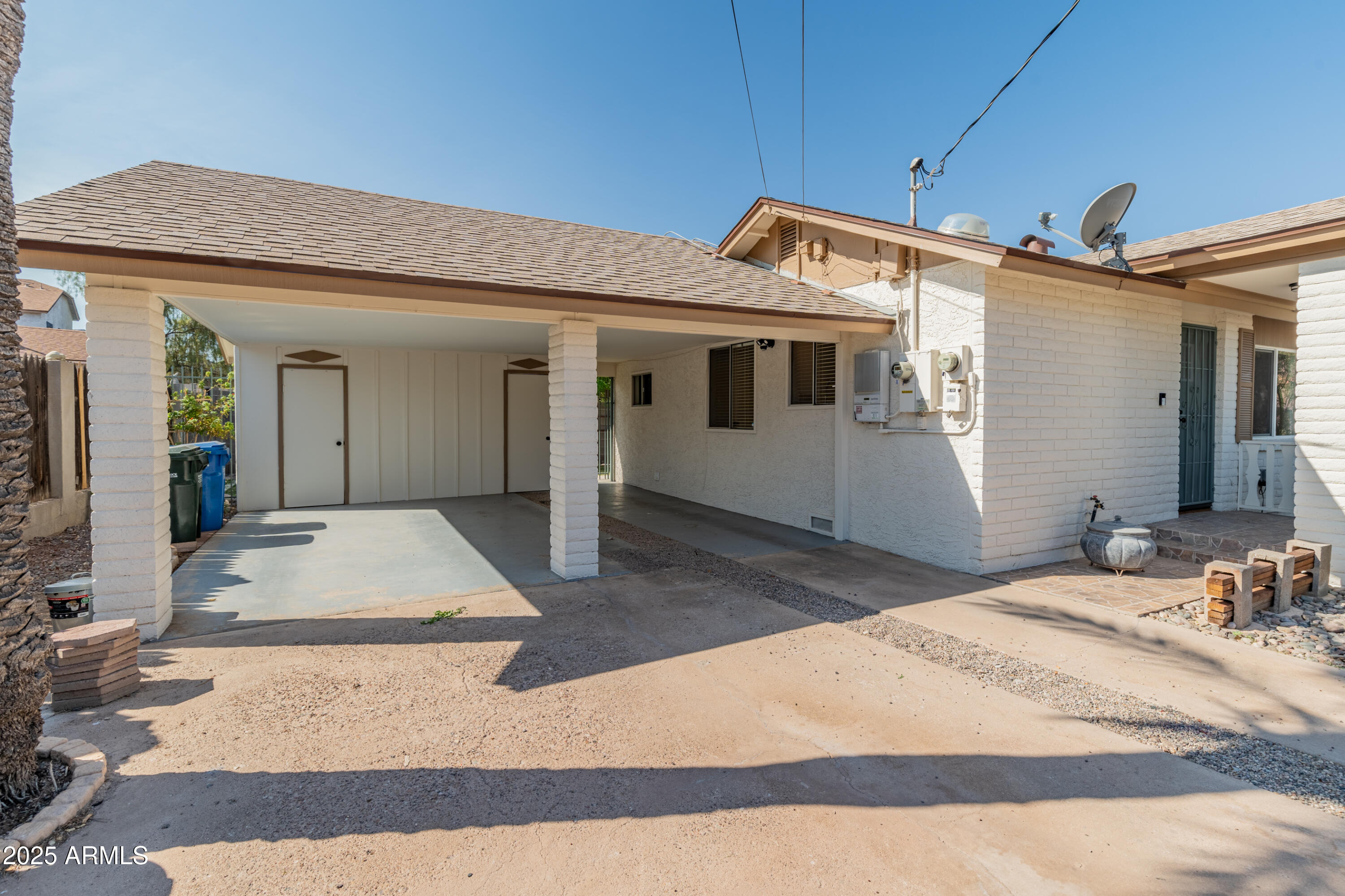 1407 East Mountain View Road Phoenix, AZ 85020 - Photo 34 of 35 a front view of a house with garage
