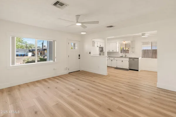 a view of a kitchen with a stove cabinets and wooden floor