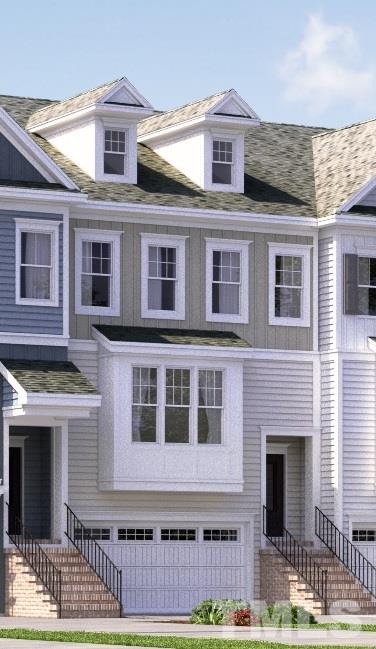 604 Edgewater Ridge Court Apex, NC 27523 - Photo 1 of 20 a front view of a building with a parking space