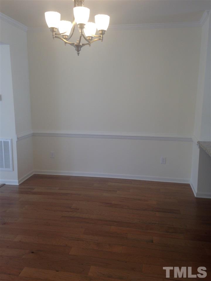 604 Edgewater Ridge Court Apex, NC 27523 - Photo 11 of 20 a view of a room with wooden floor