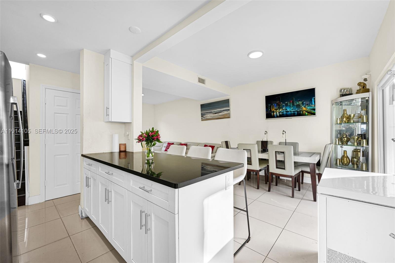 26100 Southwest 134th Place Homestead, FL 33032 - Photo 12 of 39 a kitchen with stainless steel appliances granite countertop a sink and a refrigerator