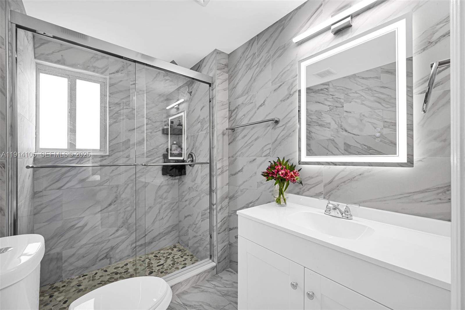 26100 Southwest 134th Place Homestead, FL 33032 - Photo 16 of 39 a bathroom with a sink toilet and shower