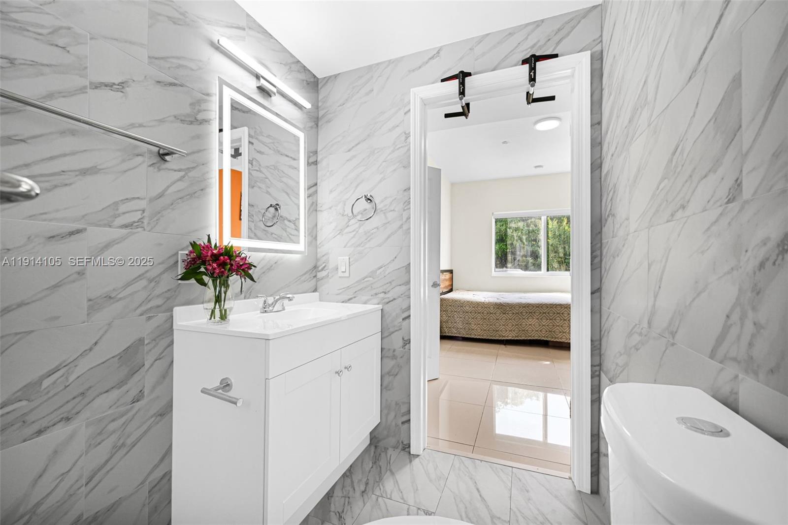 26100 Southwest 134th Place Homestead, FL 33032 - Photo 17 of 39 a en suite bathroom with a granite countertop tub sink a mirror and shower