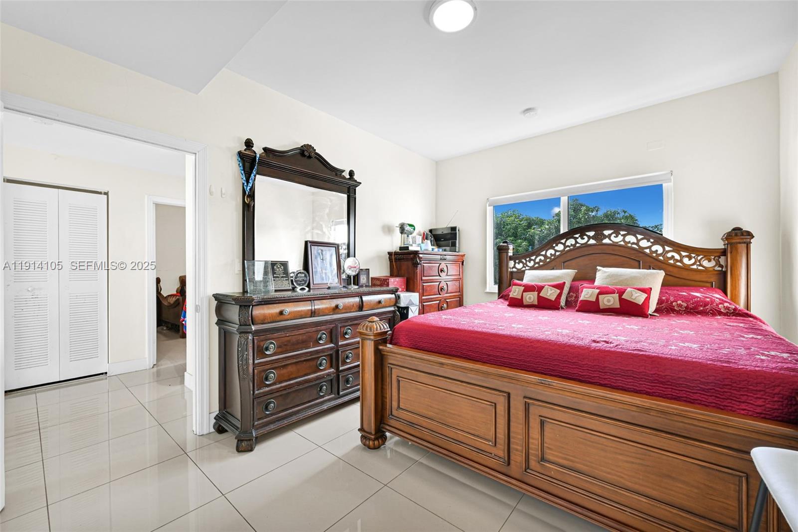 26100 Southwest 134th Place Homestead, FL 33032 - Photo 19 of 39 a bedroom with a bed and a dresser