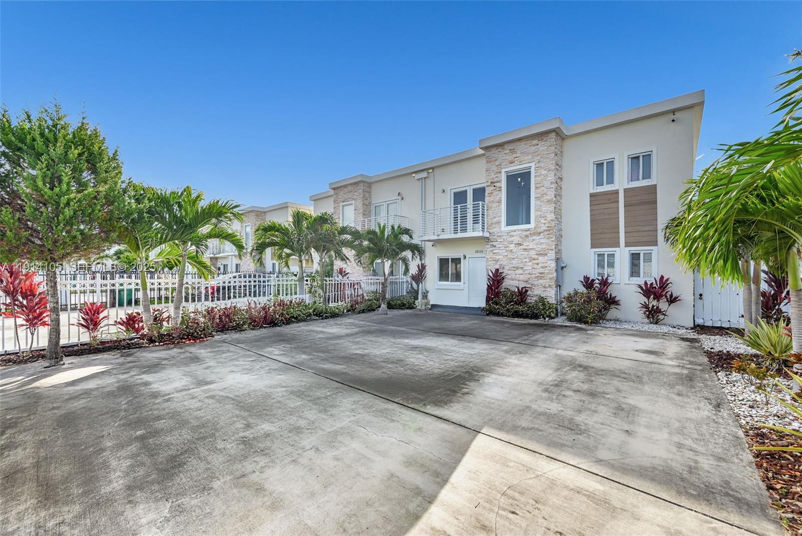 26100 Southwest 134th Place Homestead, FL 33032 - Photo 2 of 39 a view of a house with a patio