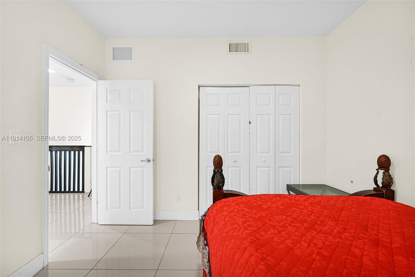 26100 Southwest 134th Place Homestead, FL 33032 - Photo 24 of 39 a bedroom with a bed and a window