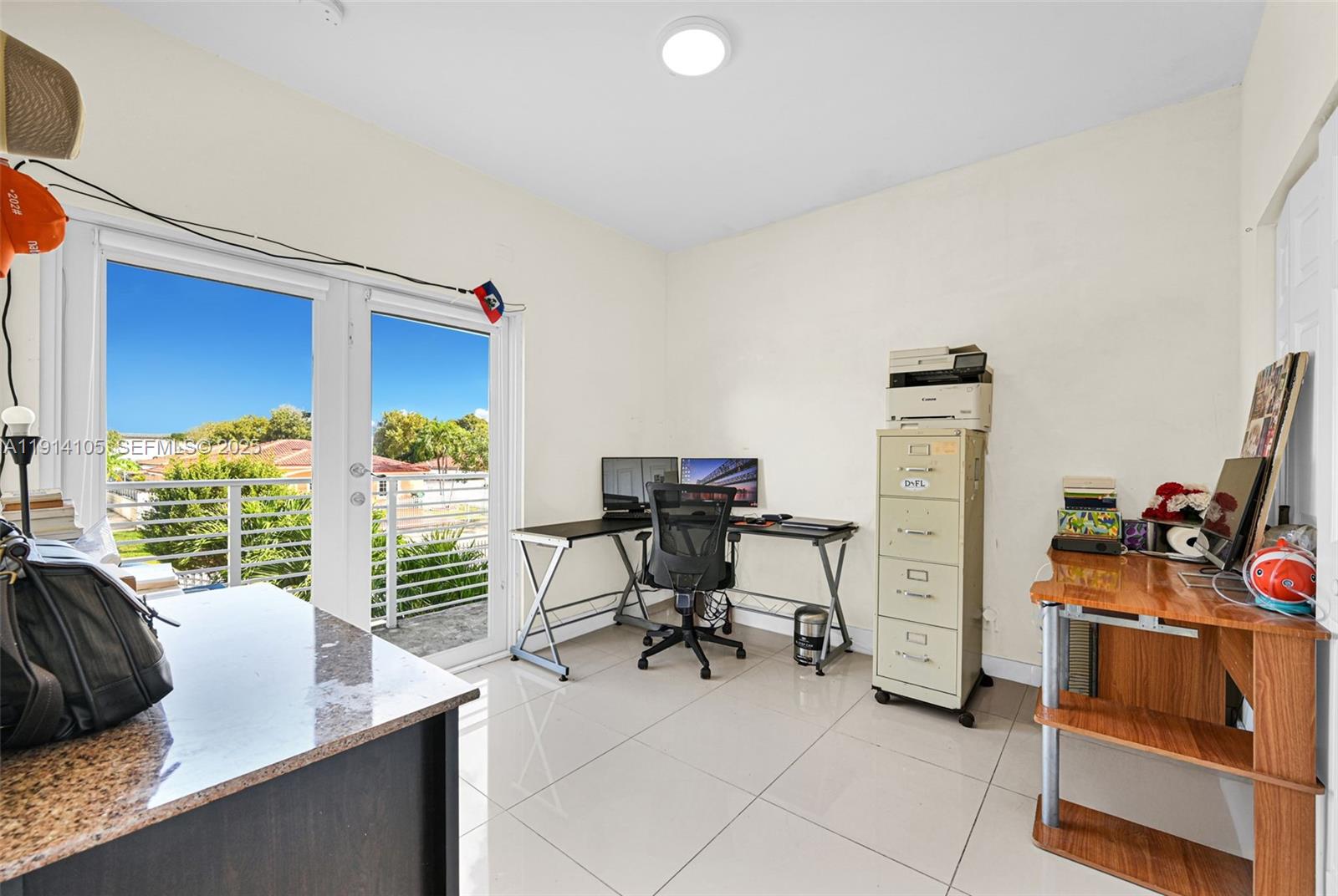 26100 Southwest 134th Place Homestead, FL 33032 - Photo 27 of 39 a view of a workspace with furniture and a window