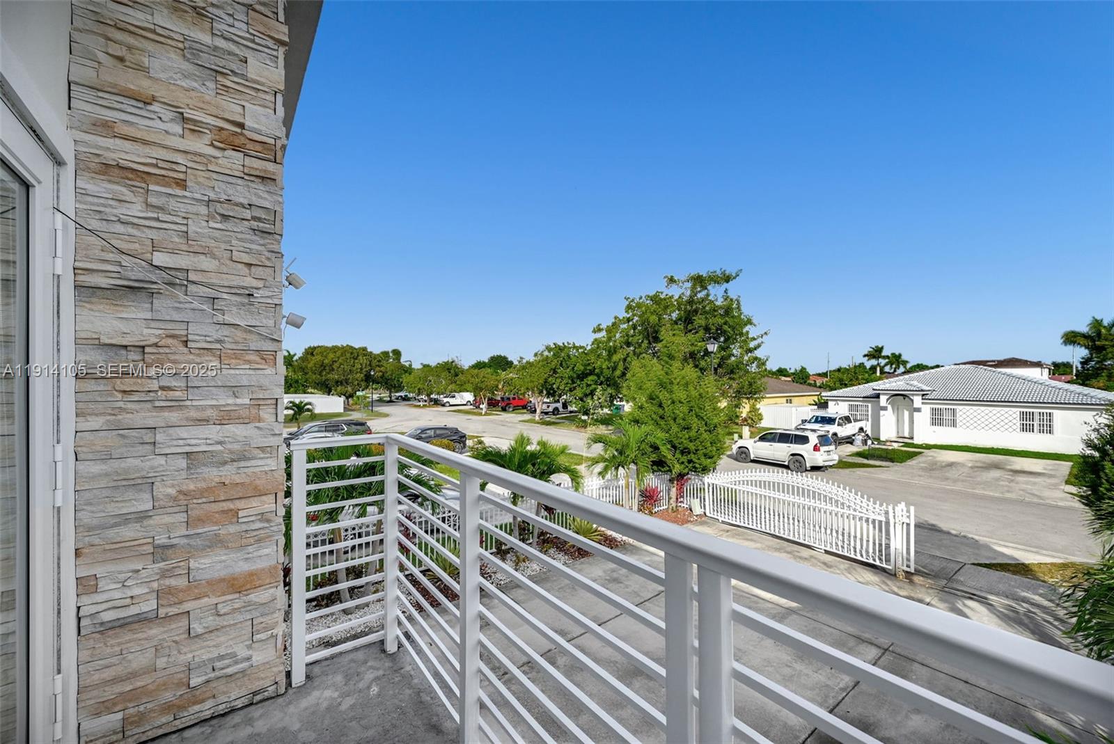 26100 Southwest 134th Place Homestead, FL 33032 - Photo 29 of 39 a view of a balcony with wooden floor and city view