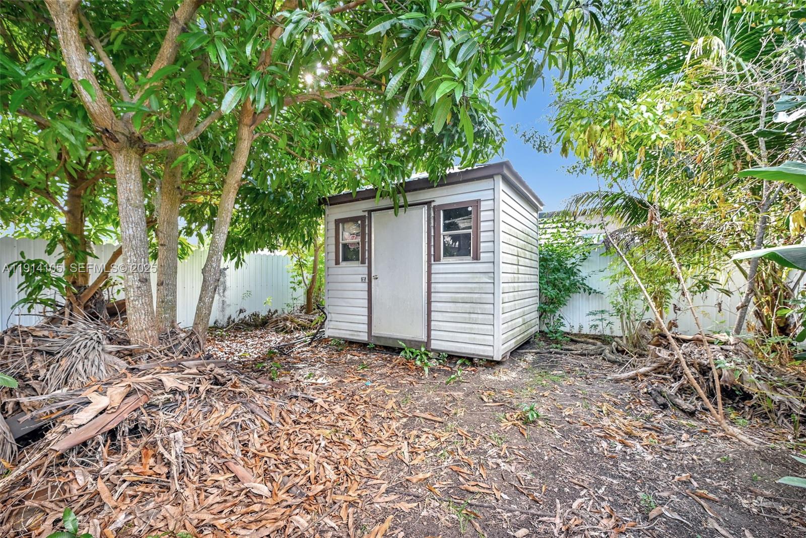 26100 Southwest 134th Place Homestead, FL 33032 - Photo 34 of 39 a view of a house with a yard and tree