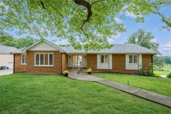 a view of a house with a yard porch and sitting area