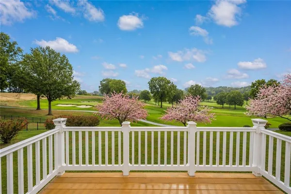 a view of a golf course with a lake